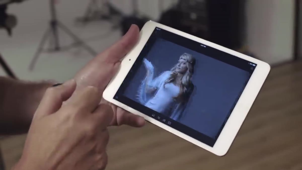 iPad screen showing Lightroom Mobile gallery with session images populating