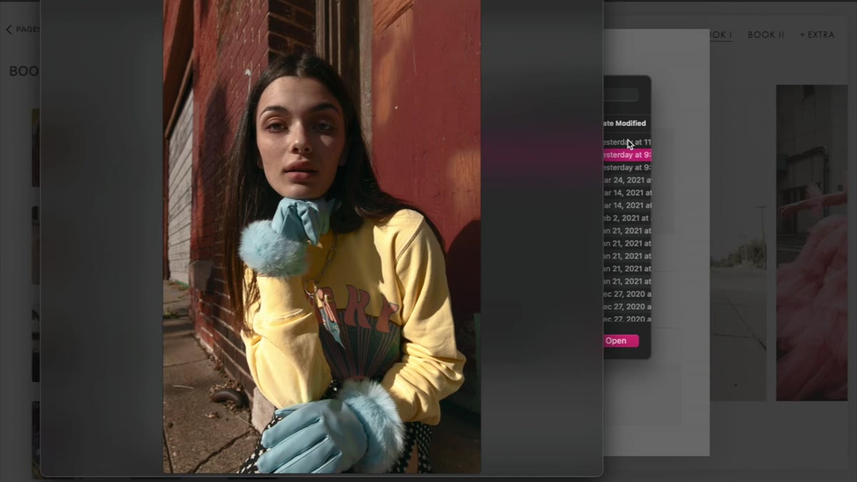Jessica reviewing multiple shoot folders to choose portfolio candidates