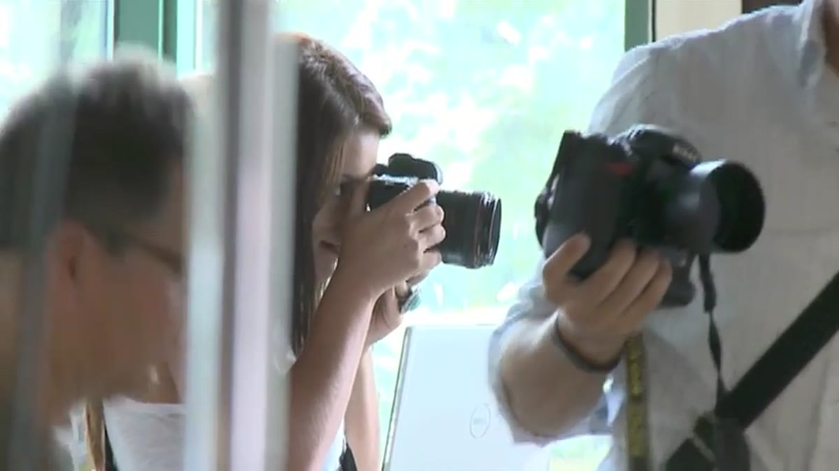 Jasmine demonstrating active posing direction with a couple on set