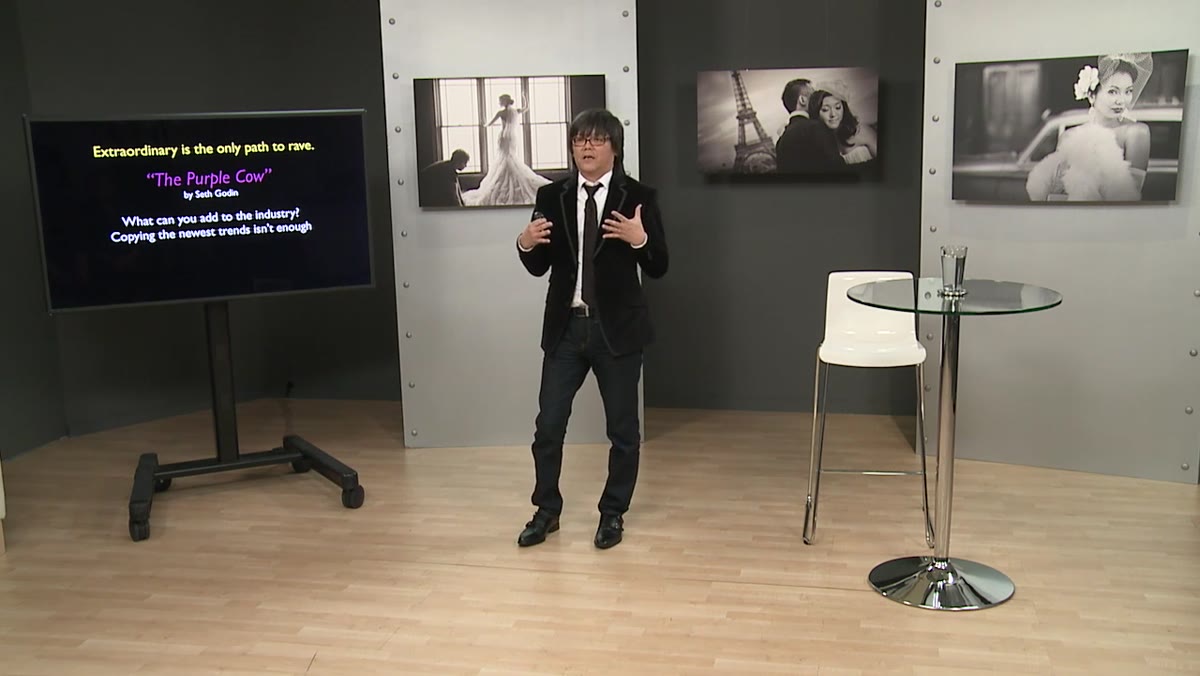 Lim gesturing as he outlines the year-by-year improvement framework